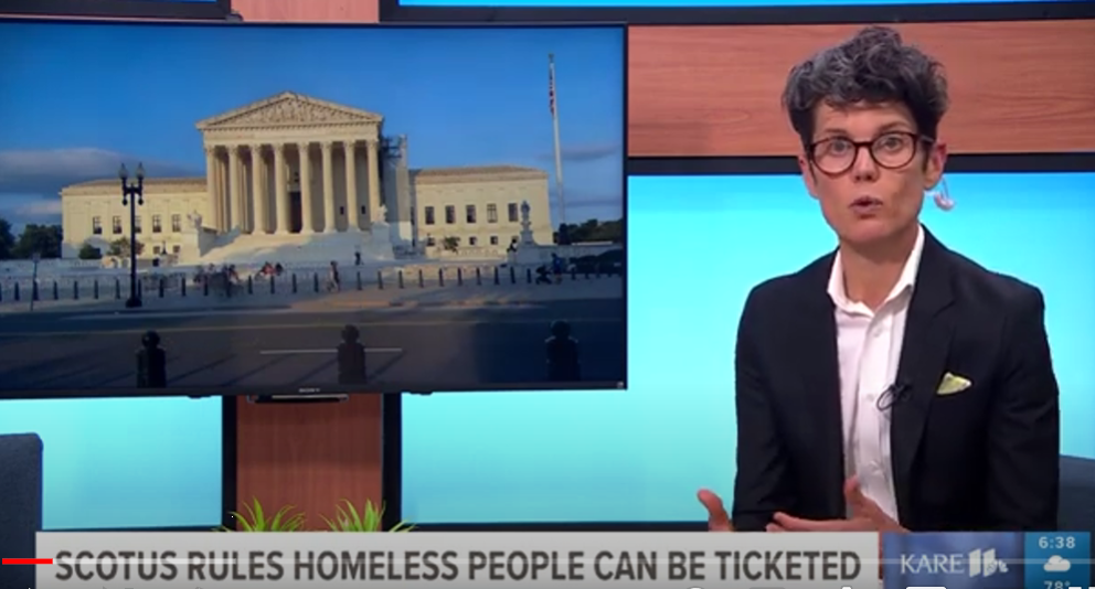 Anchor on news desk, chyron reads: Supreme Court rules homeless people can be ticketed