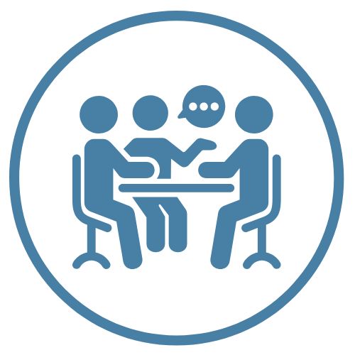 Abstract figures representing people, seated at table. Speech bubble indicates discussion.