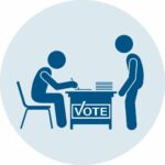 Graphic art figures of people, one sitting behind a desk with a sign that says Vote, and another standing opposite and facing the seated person who appears to be checking a list with a pen.