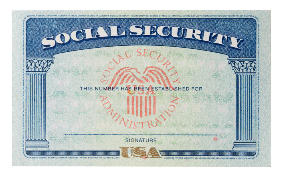 Social Security Card, blue motif with words Social Security at top, and red watermark of eagle on shield