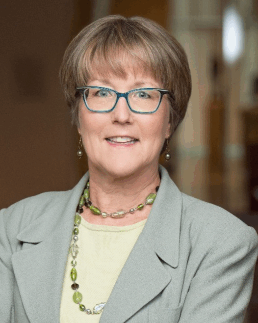 woman wearing glasses smiling