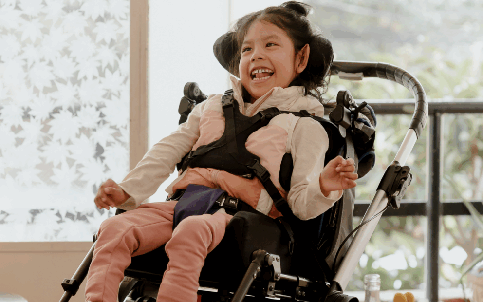 young girl in wheelchair, smiling