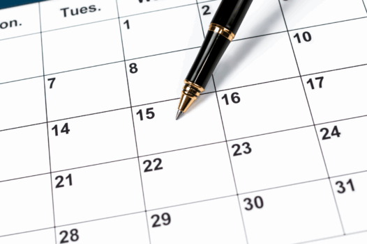 calendar with pen pointing to the 15th