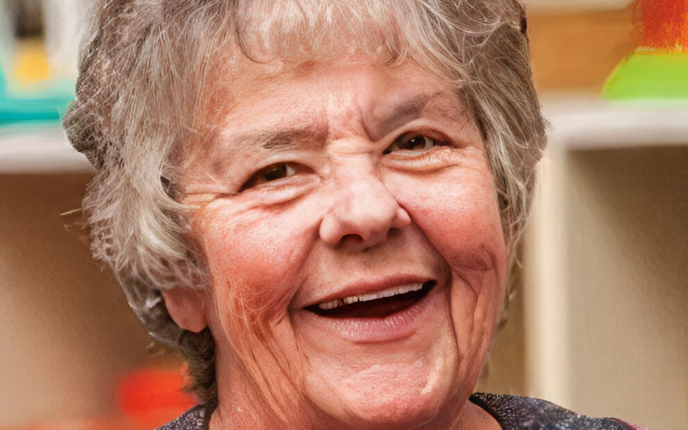 Woman with salt and pepper hair smiling