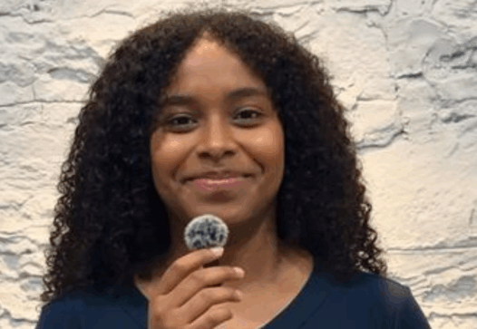 a woman holding a microphone