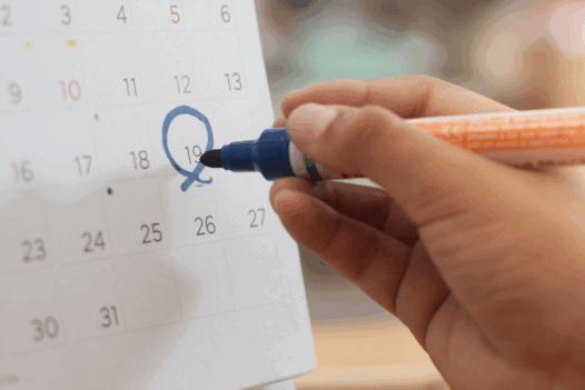 calendar with hand circling marker