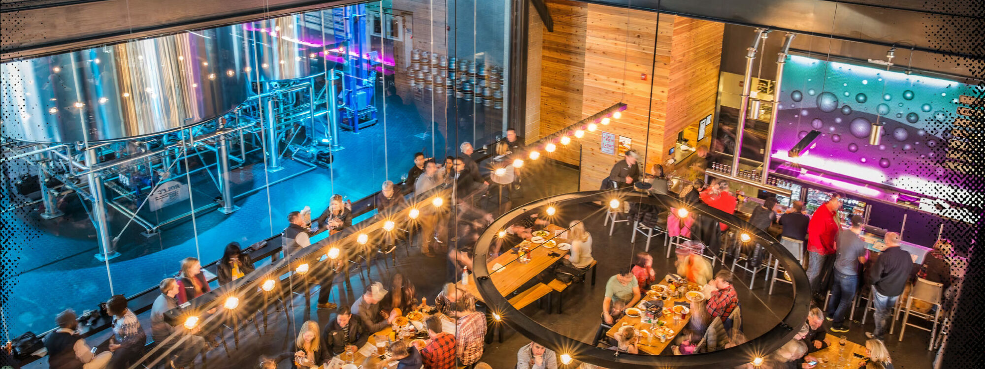 restaurant filled with people sitting at tables