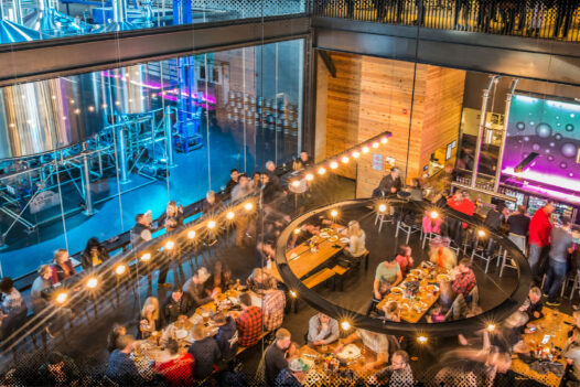 restaurant filled with people sitting at tables