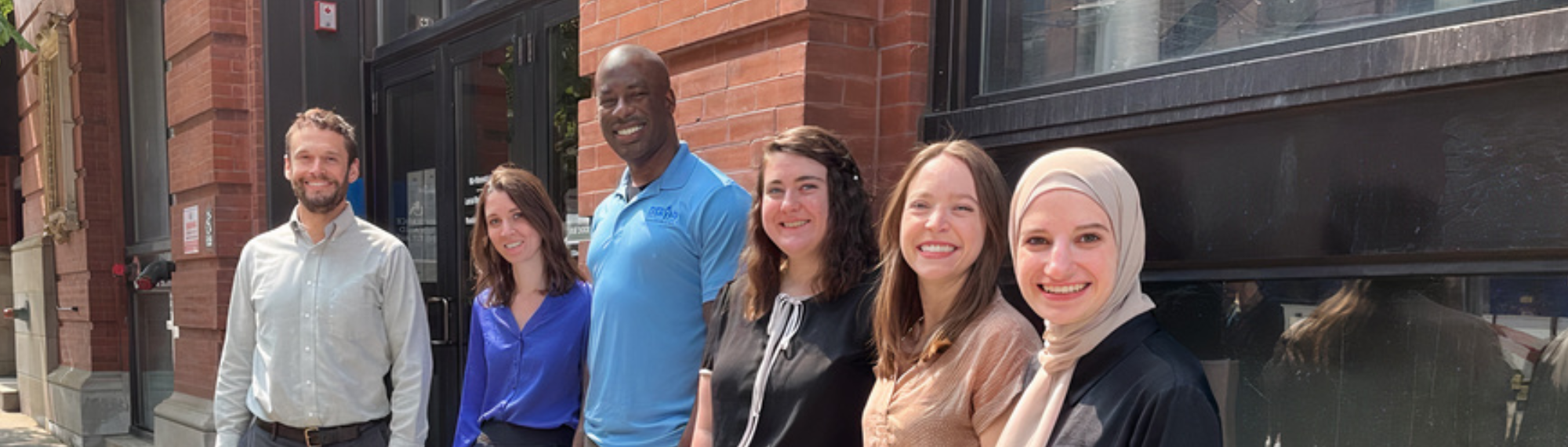 group of law clerks standing outside