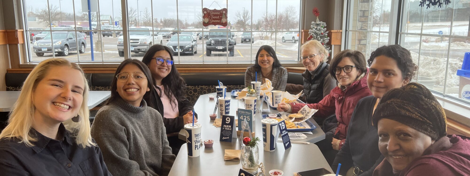 group sitting at table at a restaurant