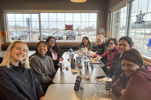 group sitting at table at a restaurant