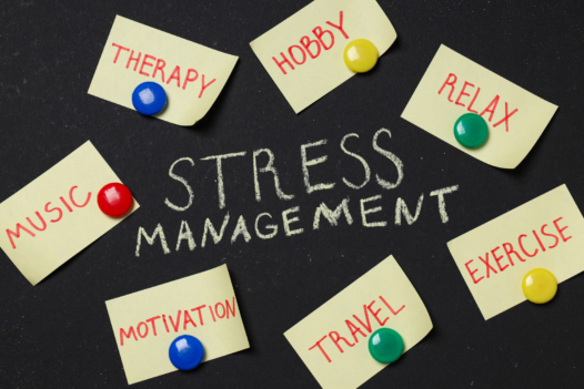 stress management written on a chalkboard, surrounded by sticky notes