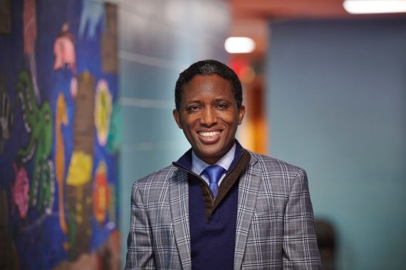 man wearing a suit smiling