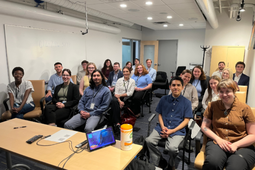 group of people sitting in a conference room